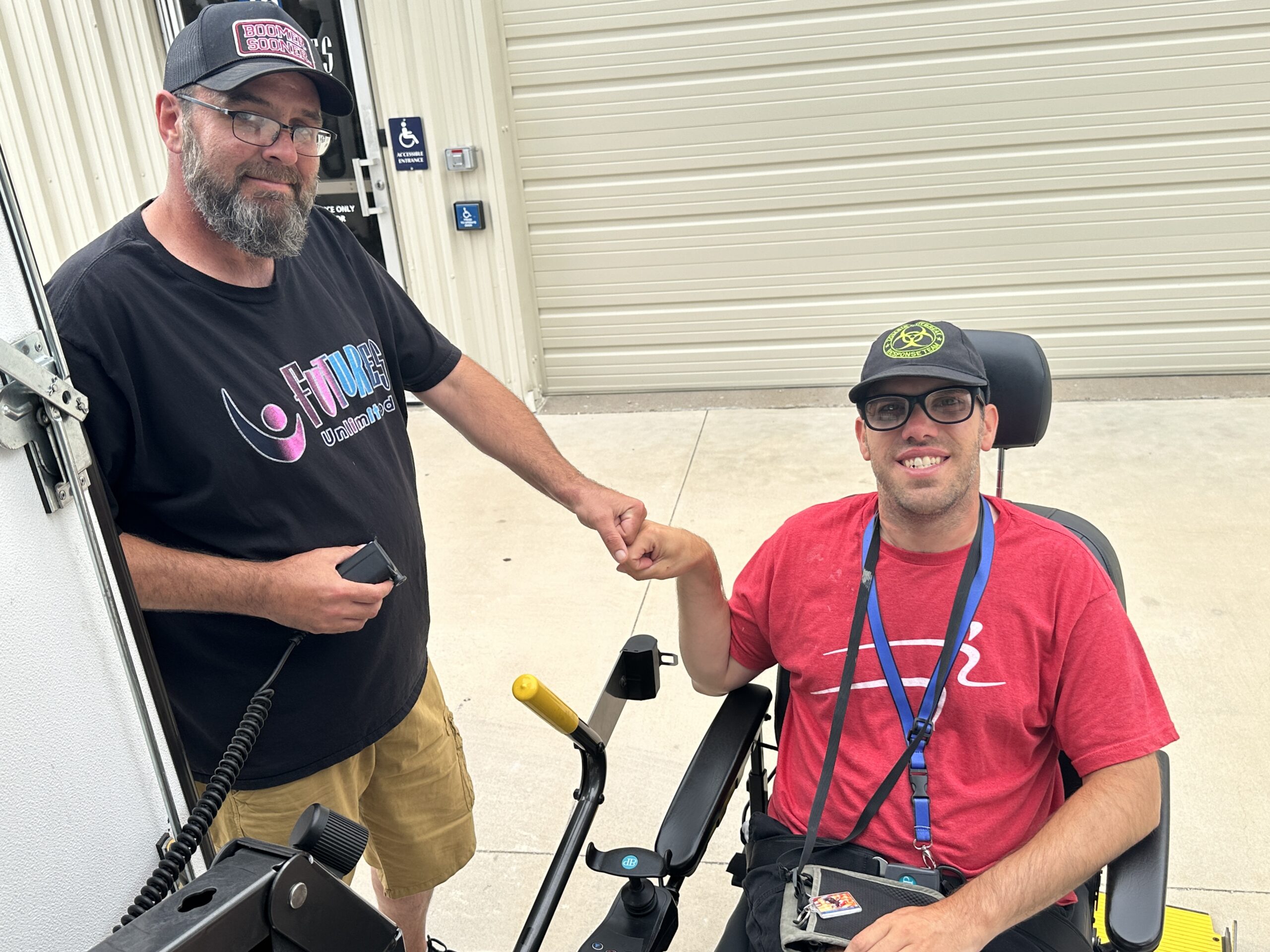 WALT driver poses with WALT rider before getting onto wheelchair lift